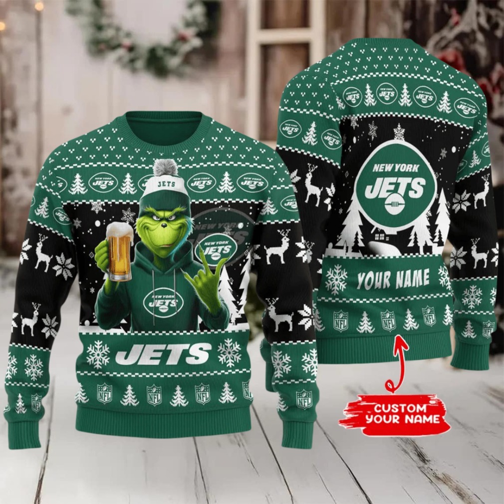 Person wearing New York Jets Ugly Christmas Sweater at a holiday gathering